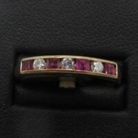 Ruby and diamond half eternity ring
